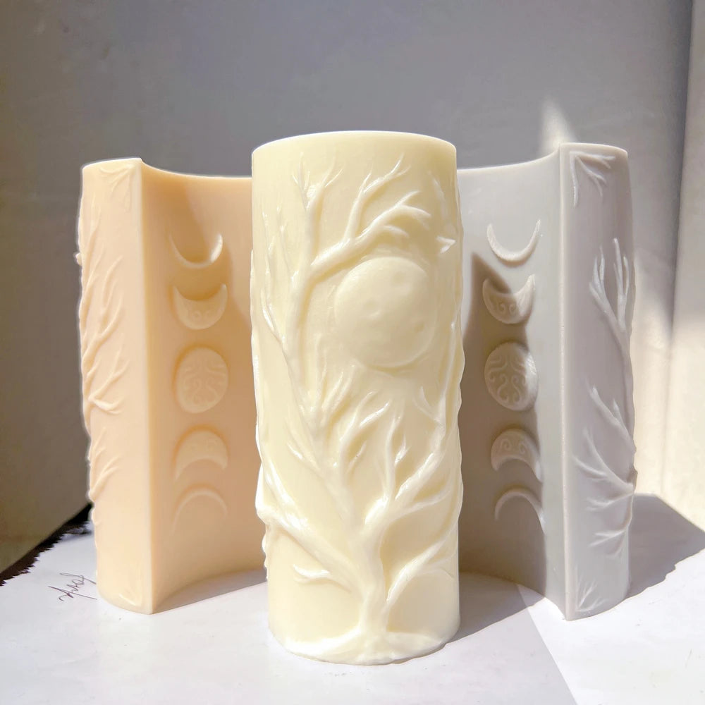 Moon-tree pillar castings showing tree relief and moon-phase panels