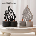 Black and silver flame motif castings standing on paired round bases