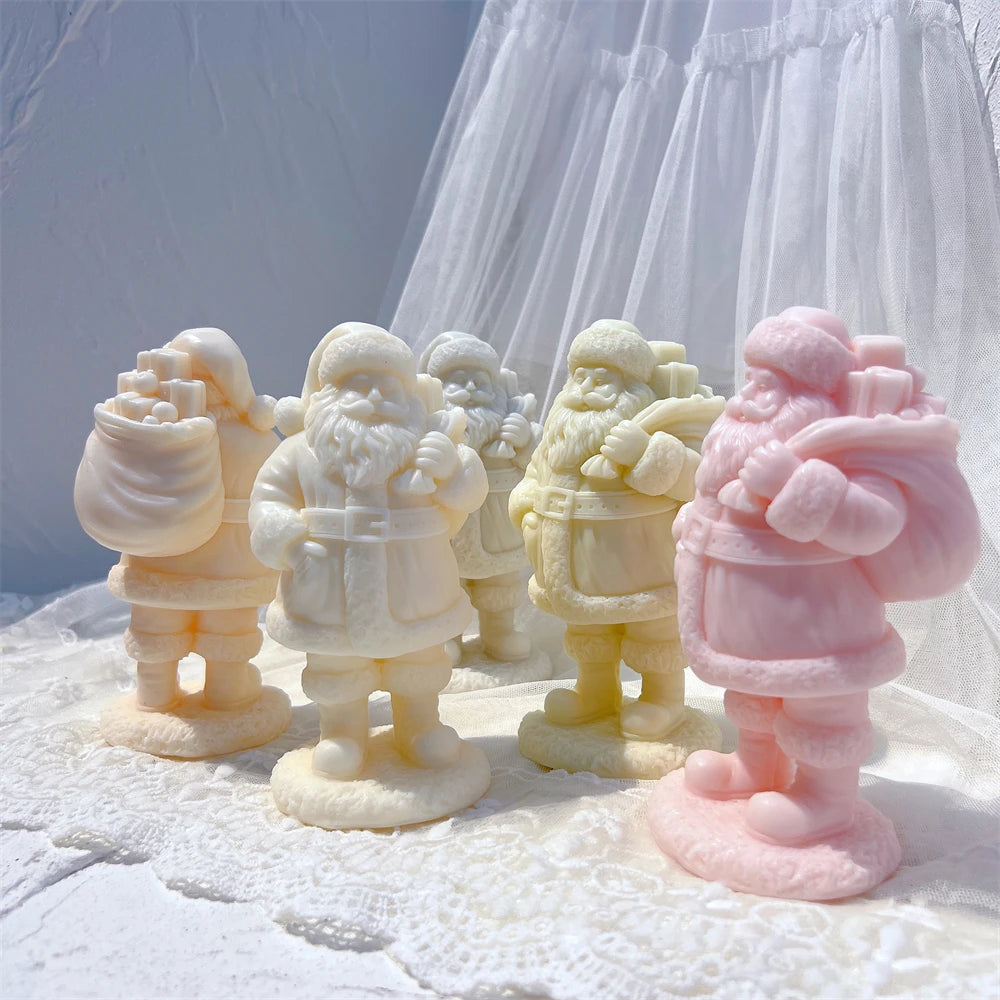Four Santa figures showing coats, boots and rounded display bases