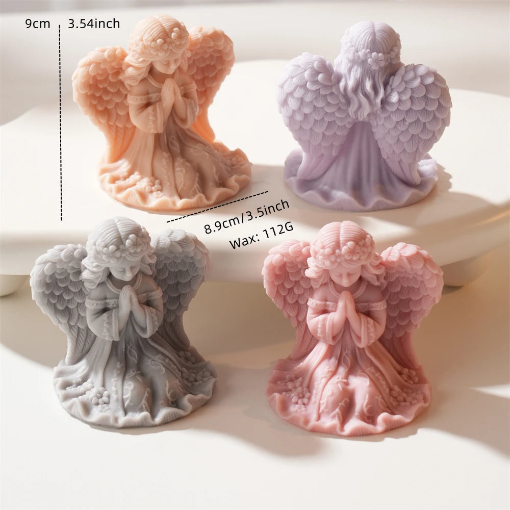 Decorative standing angel figures with feathered wings and draped dresses