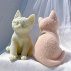 Rear of peach cat beside front-facing cream cat