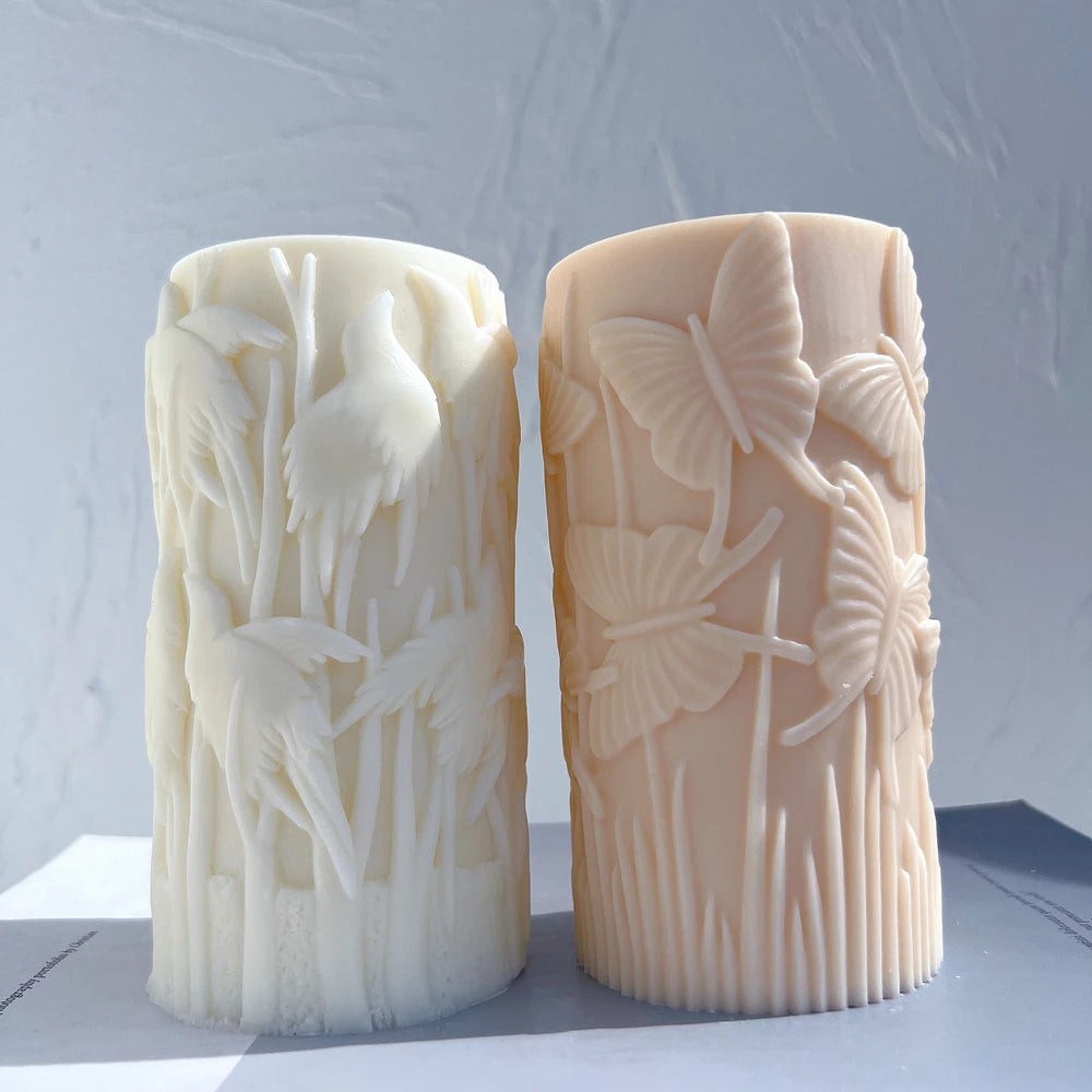 Bird pillar beside a butterfly-relief pillar