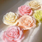 Close-up of layered rose petal candle samples