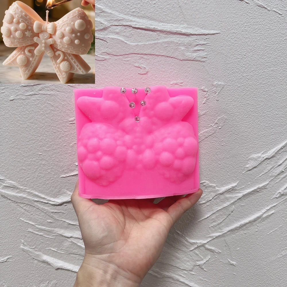 Pink silicone mold for ornate textured holiday bow casting