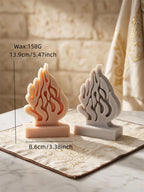 Size reference for flame sculpture: 13.9 cm tall, 8.6 cm wide, 158 g wax
