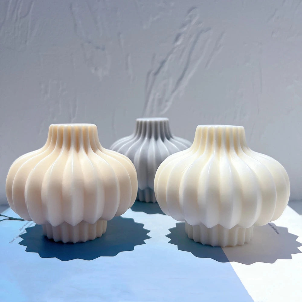 Three compact round bulb castings with short necks