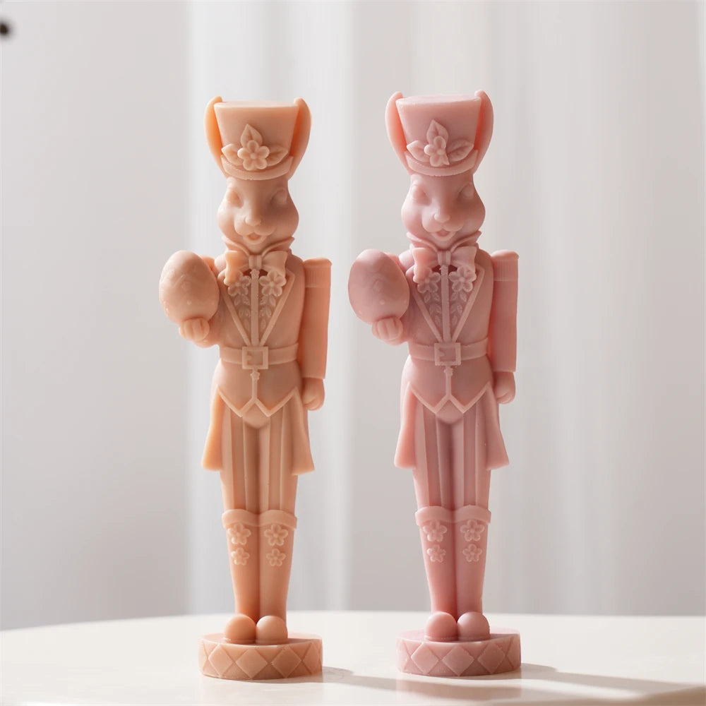 Peach and pink egg-holding rabbit soldiers on round bases