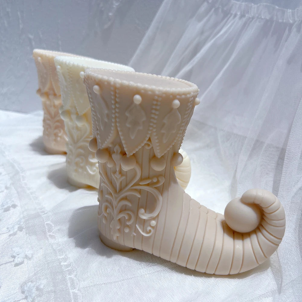 Cream elf boot showing ribbed foot and rounded toe tip