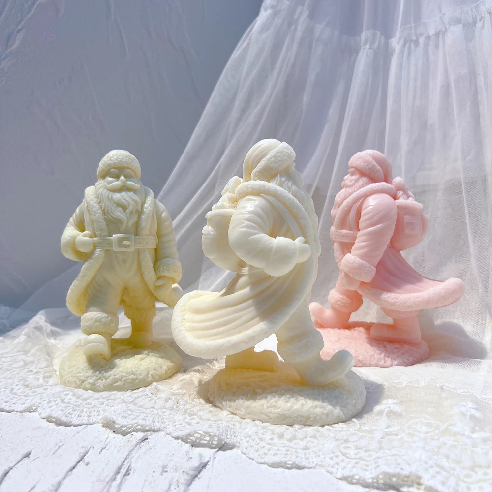 Walking Santa castings carrying sacks over their shoulders