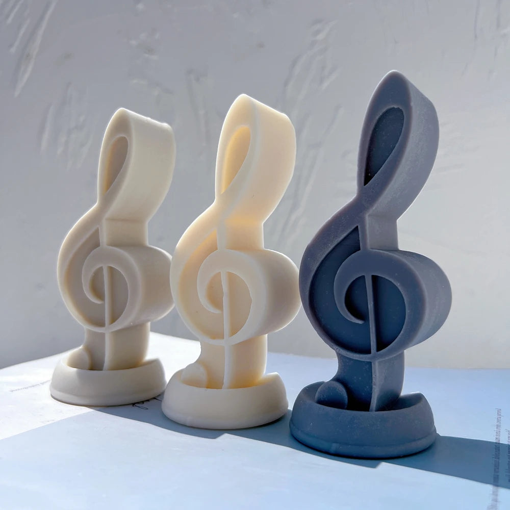 Cream yellow and blue treble clef castings on oval bases