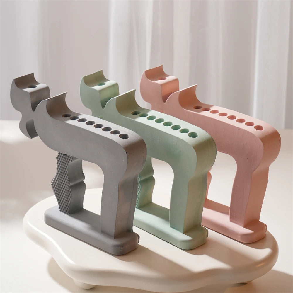 Three Chai multi-candle holders with open-frame silhouettes