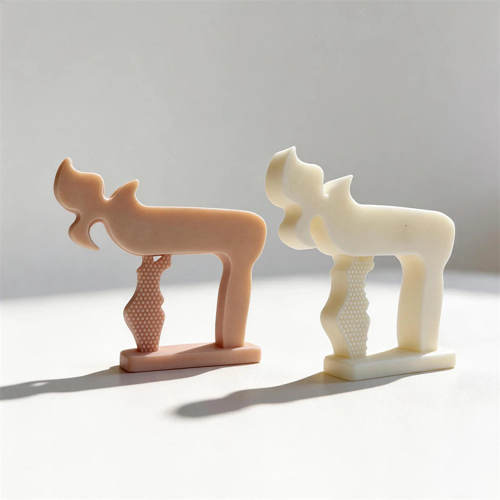 Two Chai sculptures showing smooth outer forms and inset textures