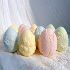 Egg candle castings with floral and butterfly reliefs