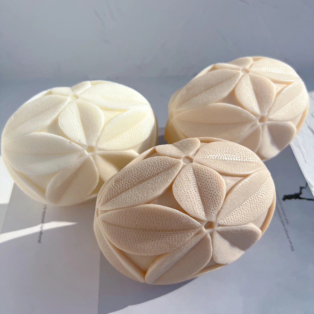 Top and side views of the leaf-pattern geometric castings