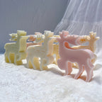 Standing snowflake-pattern reindeer sculptures from front and side