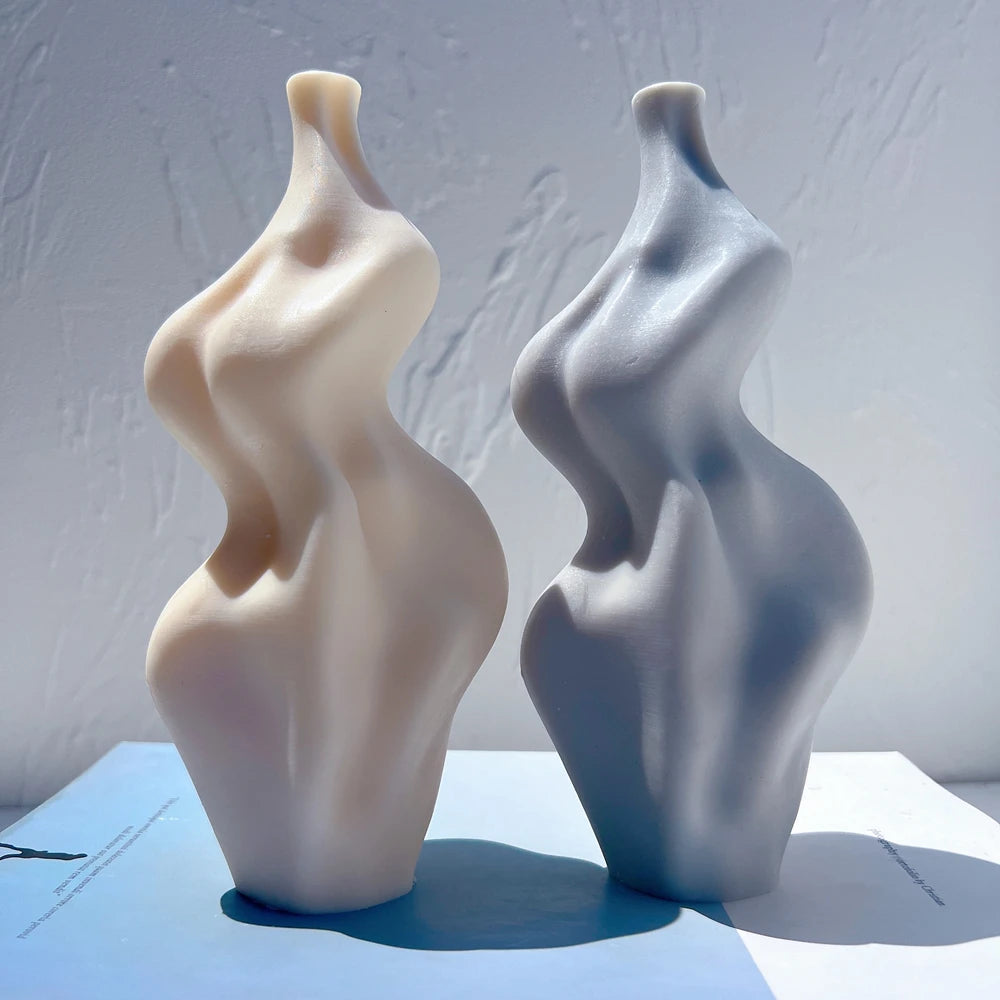 Angled view of smooth fluid twist candle castings