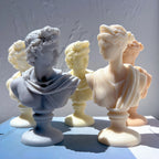 Classical draped bust candles showing two distinct hair and drapery styles