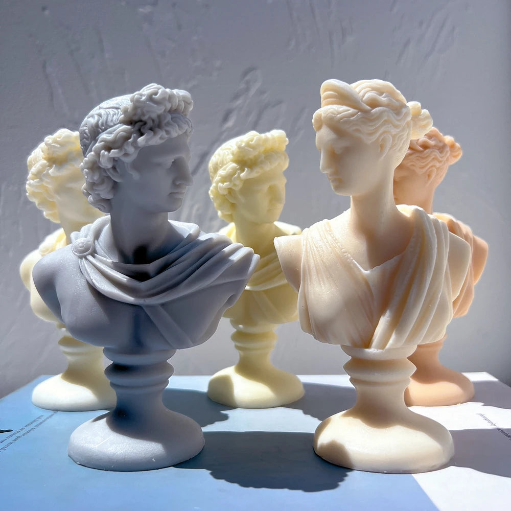 Classical draped bust candles showing two distinct hair and drapery styles