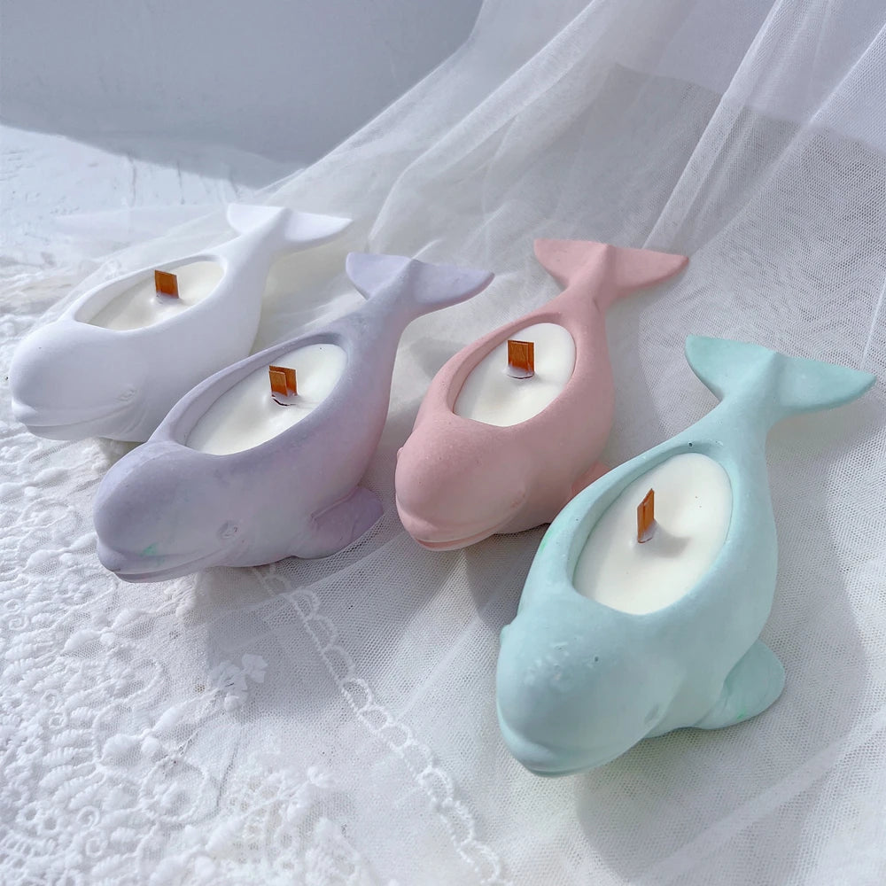 Three beluga-shaped castings showing curved heads and shallow recesses