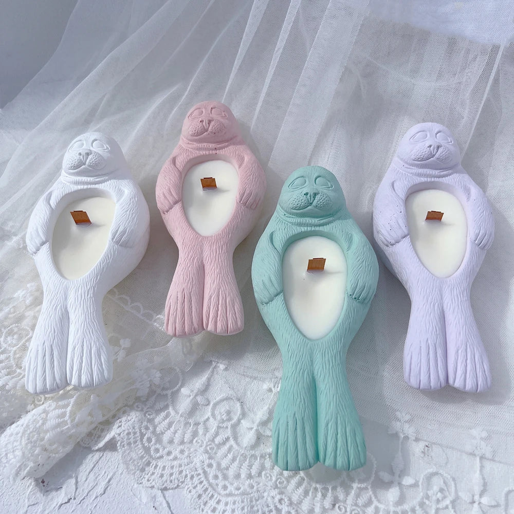 Front view of seal tea light holders in pastel colors