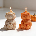 Pumpkin bear candle examples beside Halloween pumpkins