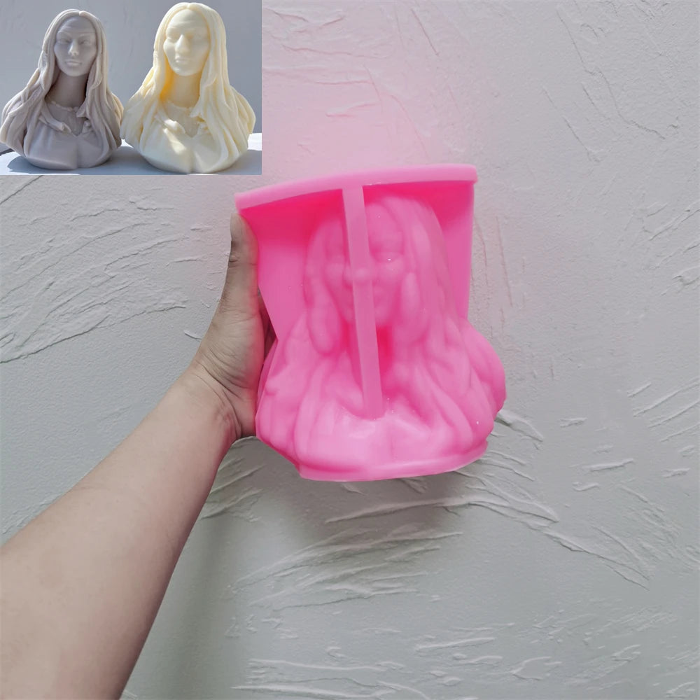 Pink flowing-hair woman bust silicone mold held in one hand