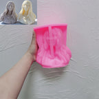 Pink flowing-hair woman bust silicone mold held in one hand