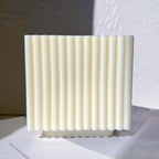 Straight-on view of parallel ribs across a block face