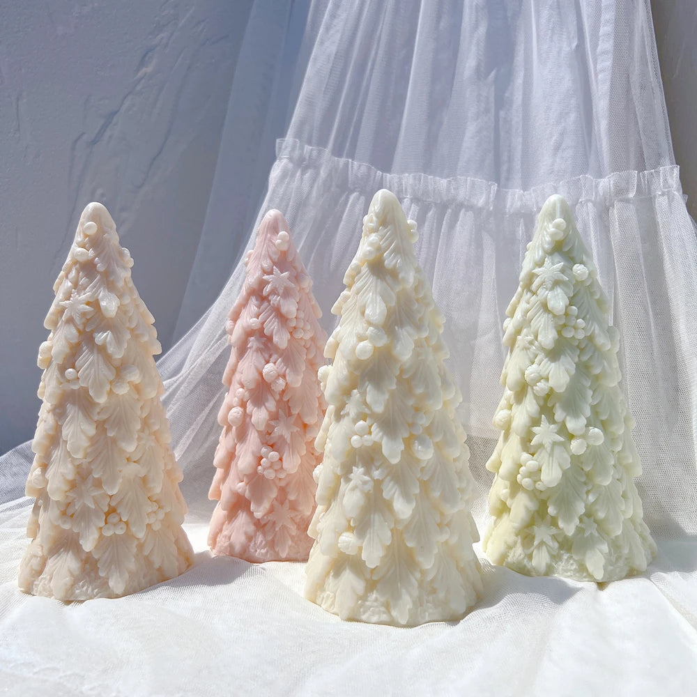 Four individual Christmas tree samples with pointed tops and dense branch texture