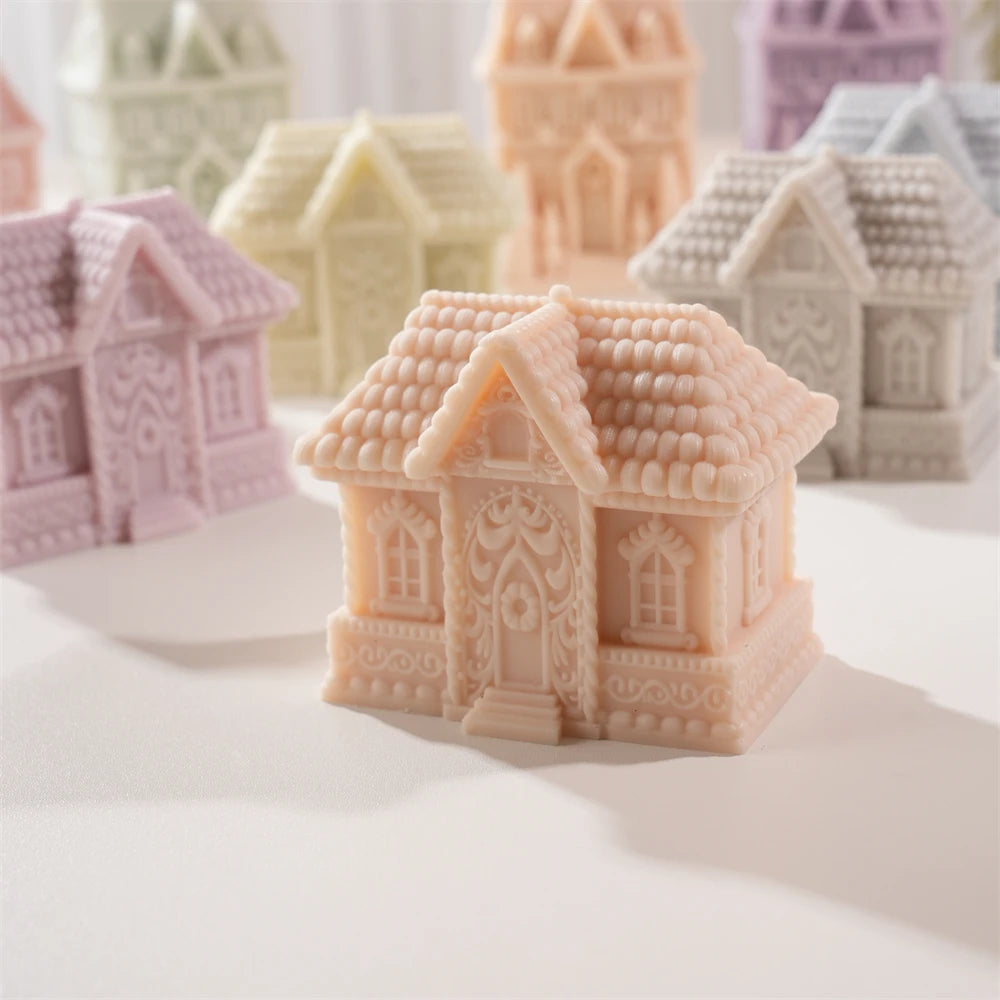 Peach gingerbread cottage candle with tiled roof and detailed front door