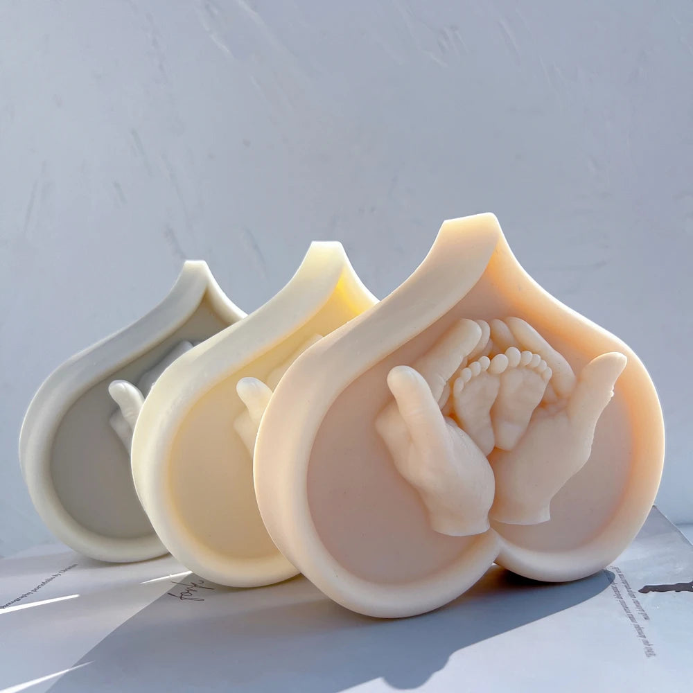 Pink and cream heart relief ornaments with raised family hand details