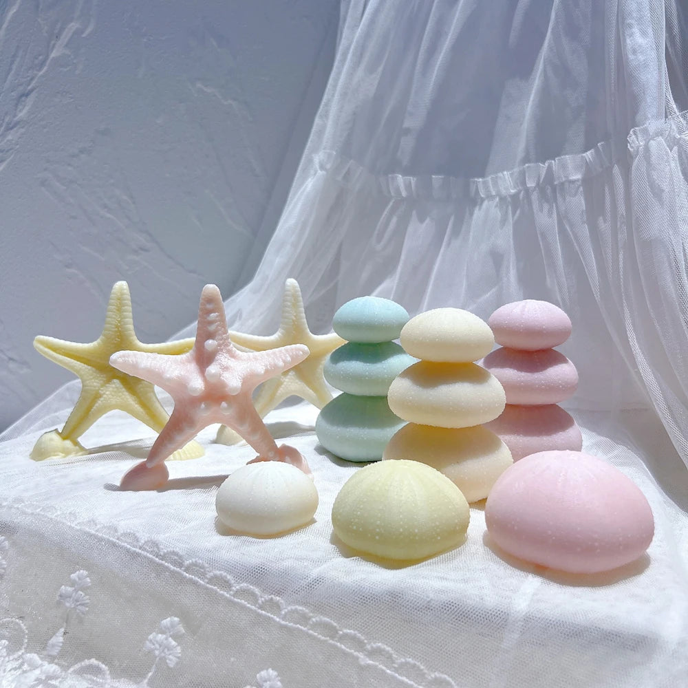Starfish and rounded sea-urchin candle designs
