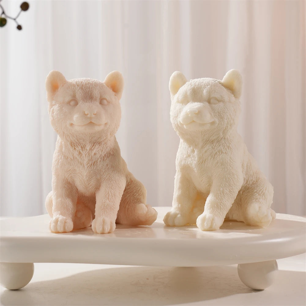 Peach and cream Shiba Inu castings viewed from the front