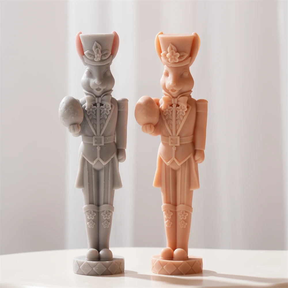 Gray and peach rabbit soldiers with decorated hats and boots