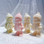 Winter gingerbread-style figures wearing hats scarves and coats