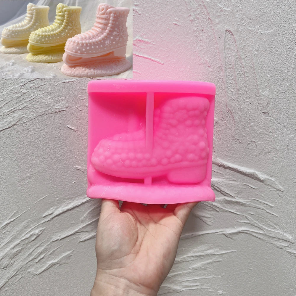 Pink silicone mold for a lace-up ice skate boot with a finished candle example
