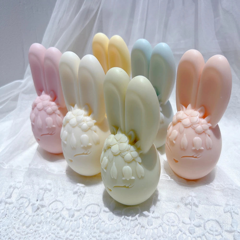 Side view of long-eared bunny egg candles and flower crown details
