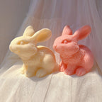 Cream and coral seated rabbits with raised heads