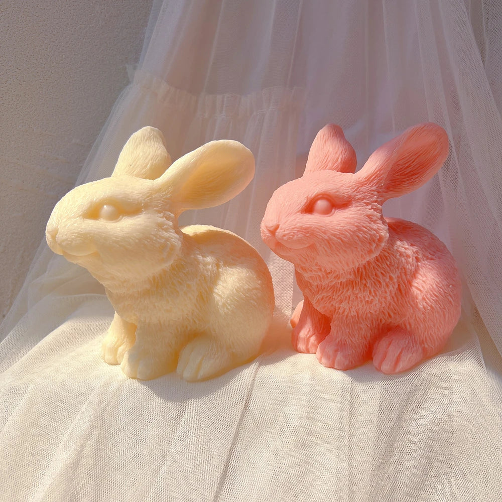 Cream and coral seated rabbits with raised heads
