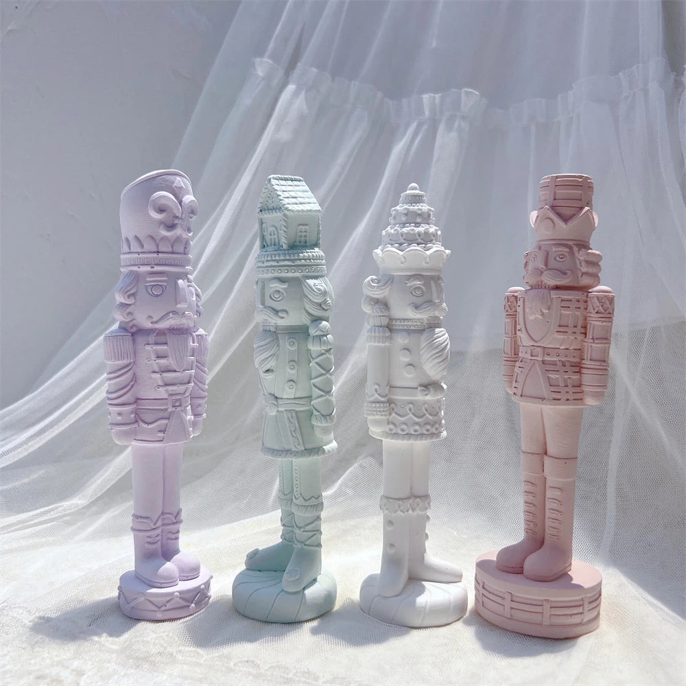 Closer view of four nutcracker castings with mustaches and uniform relief