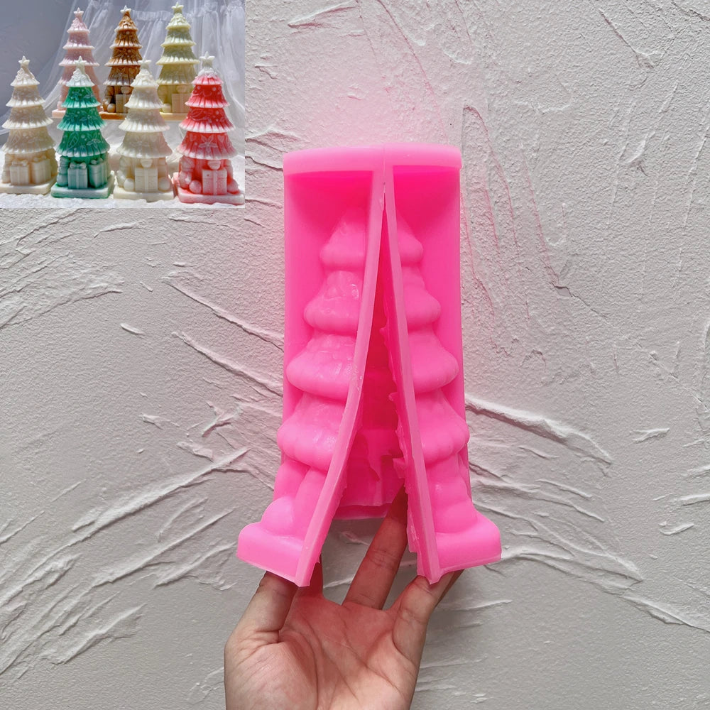 Pink gift-base Christmas tree silicone mold held in one hand