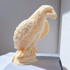 Side view of layered eagle wing feathers and oval base