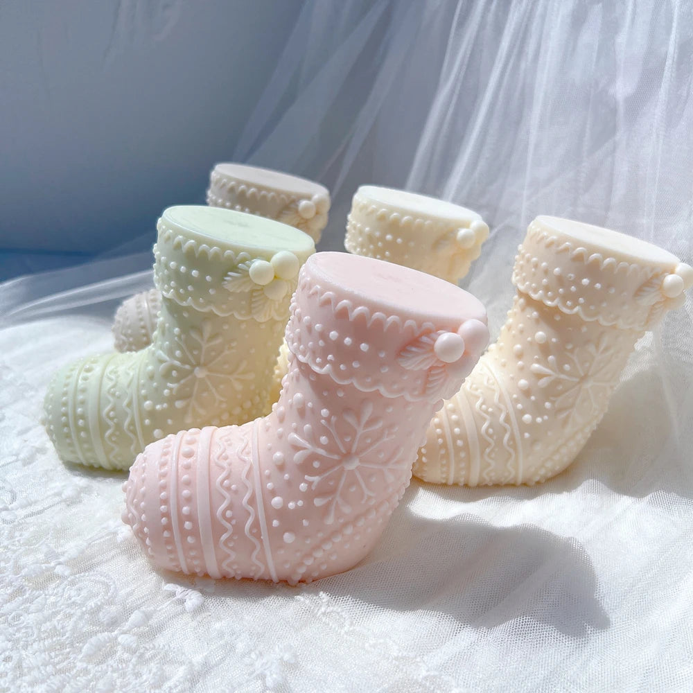 Angled view of cream mint and pink stocking figures