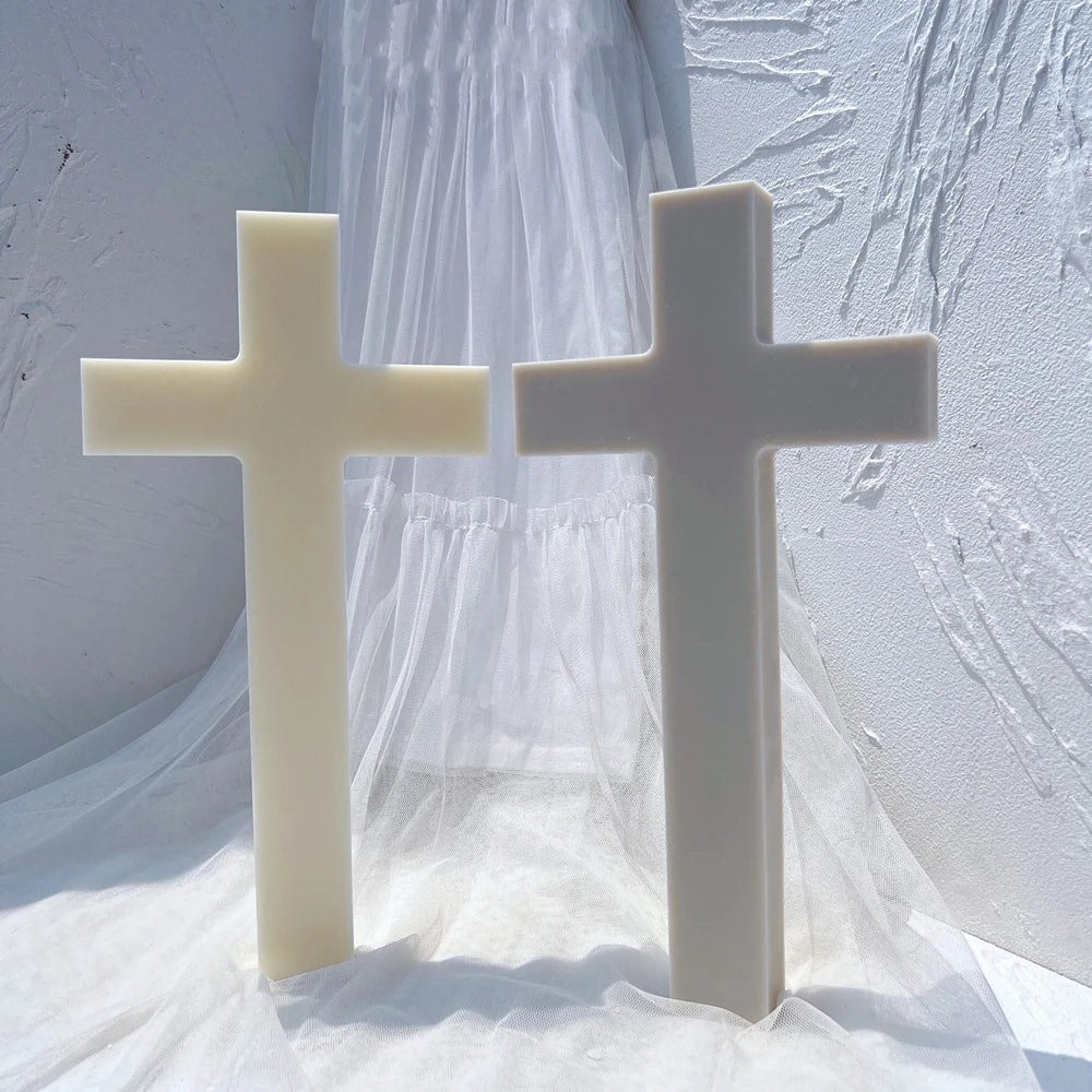 Two upright plain cross castings in cream and gray