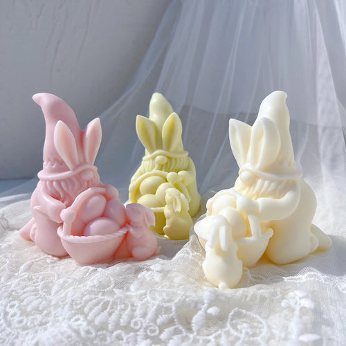 Pastel seated gnomes with egg baskets arranged on lace
