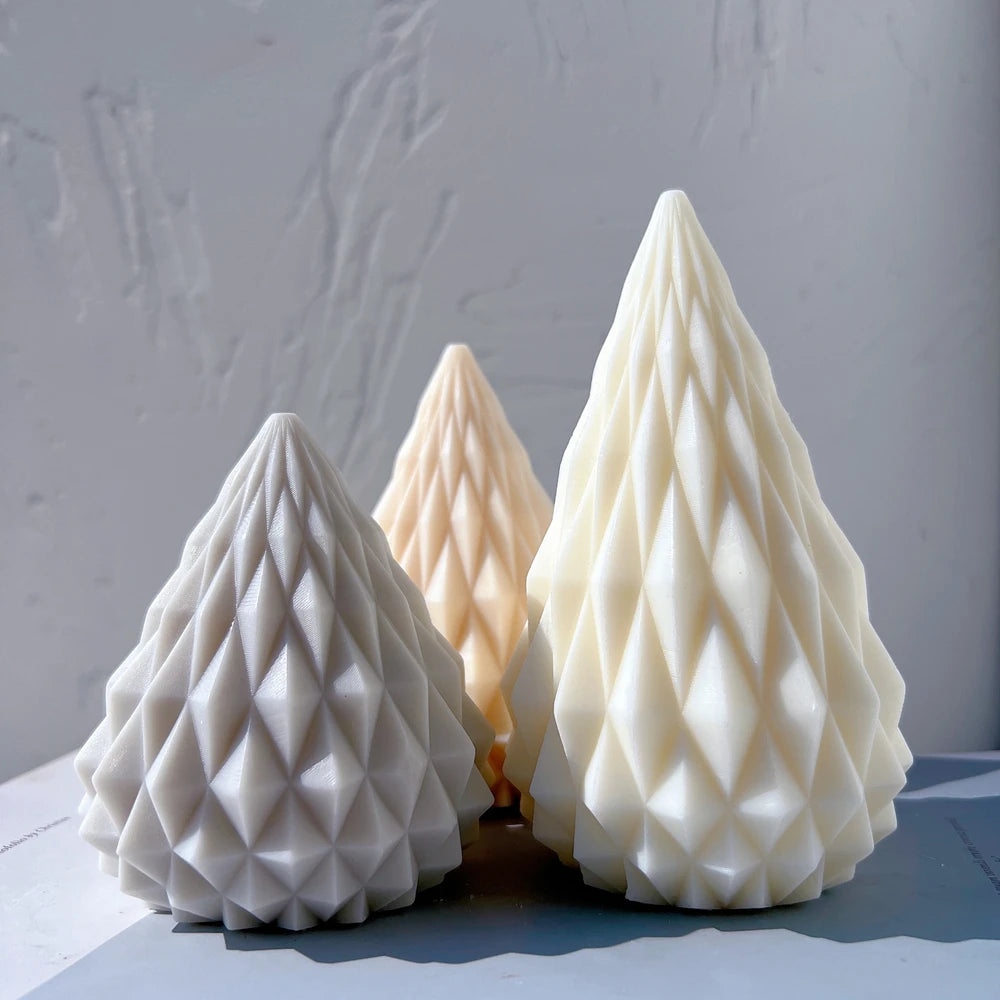 Gray peach and cream cone candles with raised geometric facets