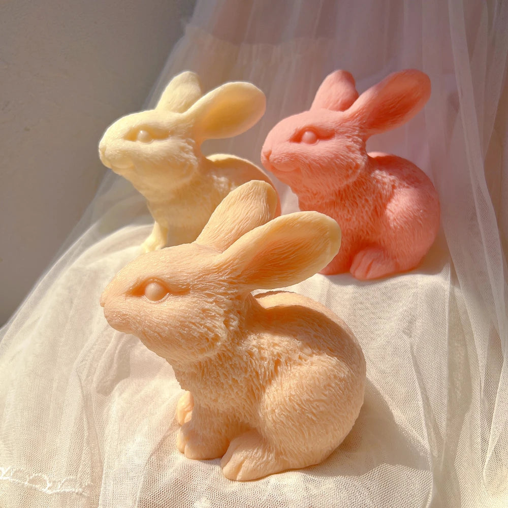 Three fur-textured rabbit castings with swept-back ears