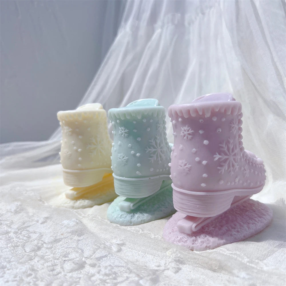 Rear view of cream mint and lavender boot candles on skate blades