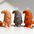 Front-facing beige, gray and orange mummy gnome candles