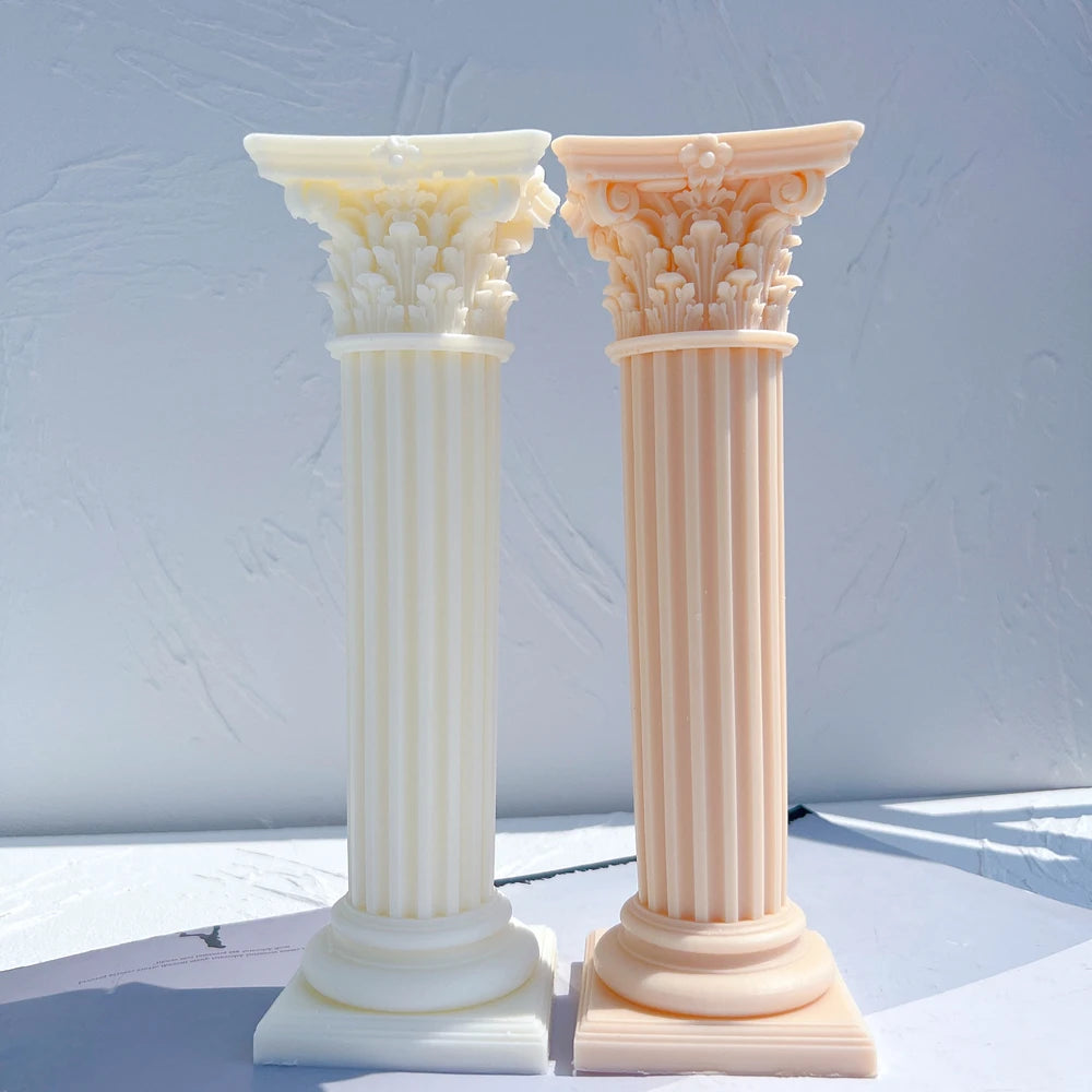 Two ornate column castings with stepped bases